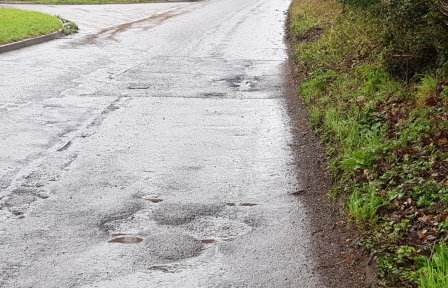 Badly potholed road causes suspension damage